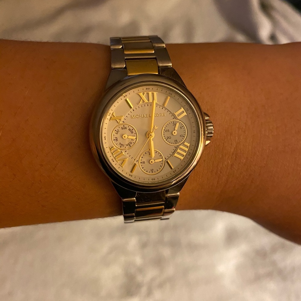 Michael Kors women’s silver/gold watch white face